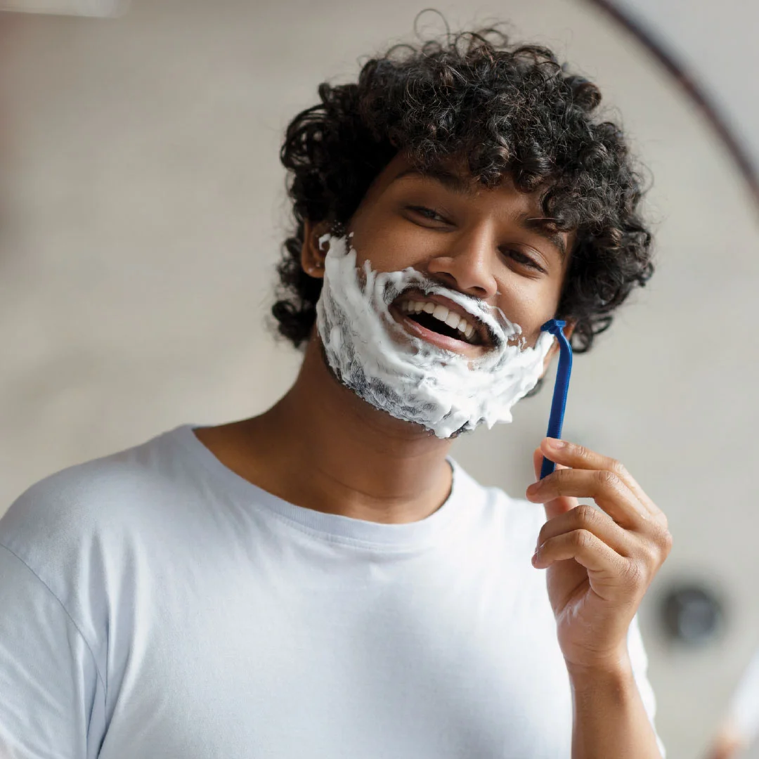 A man using Ark shaving cream